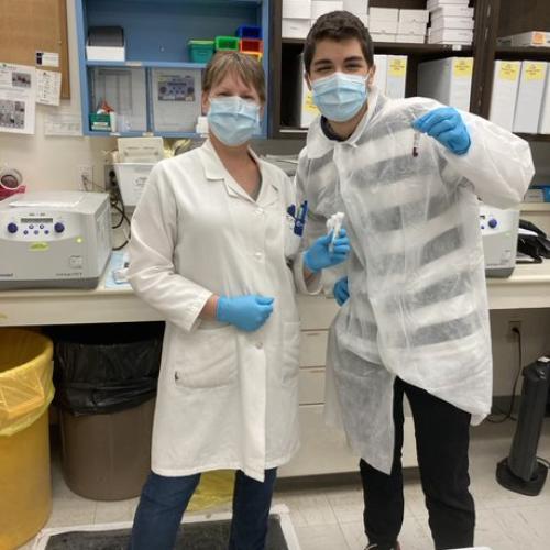Two co-op students in a research lab